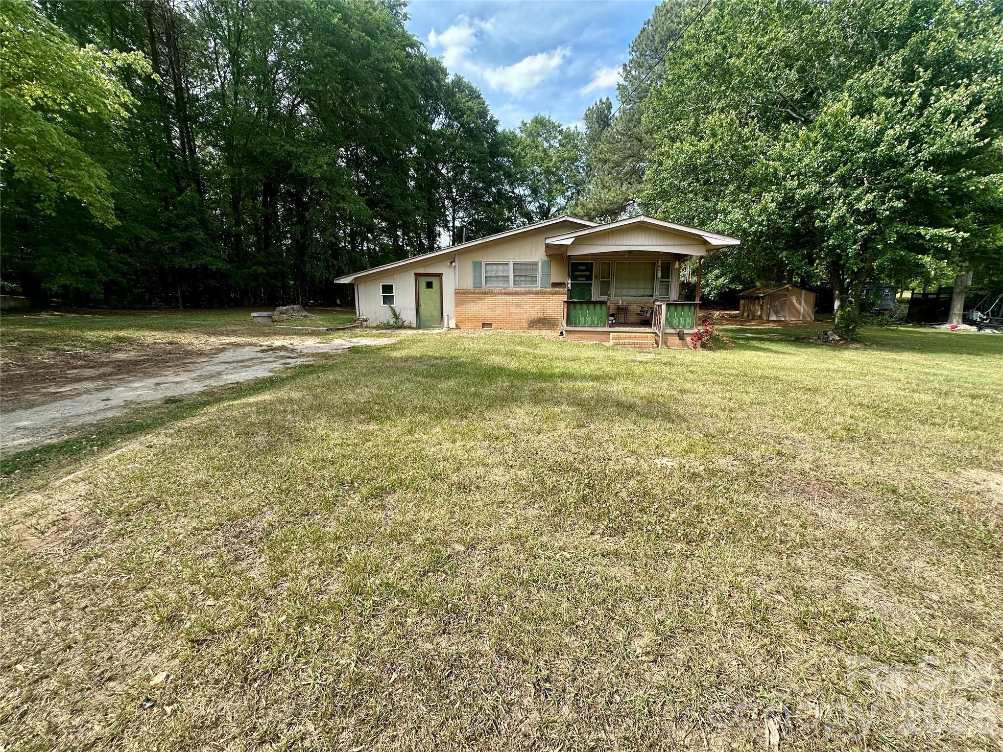 119 Stedman Road Dallas, NC 28034 - Photo 2 of 11 a front view of a house with a yard