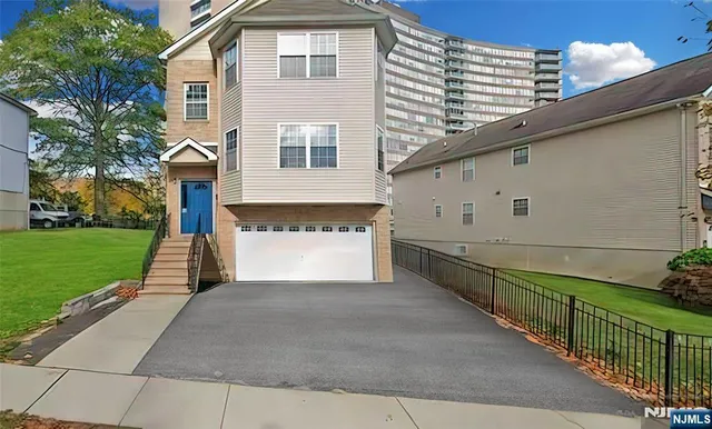 a front view of a house with yard