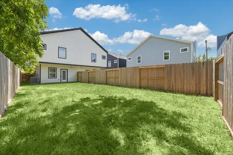 a view of a backyard of the house