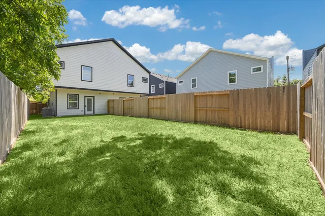 a view of a backyard of the house