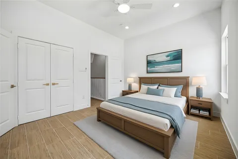 a bedroom with a bed and a painting