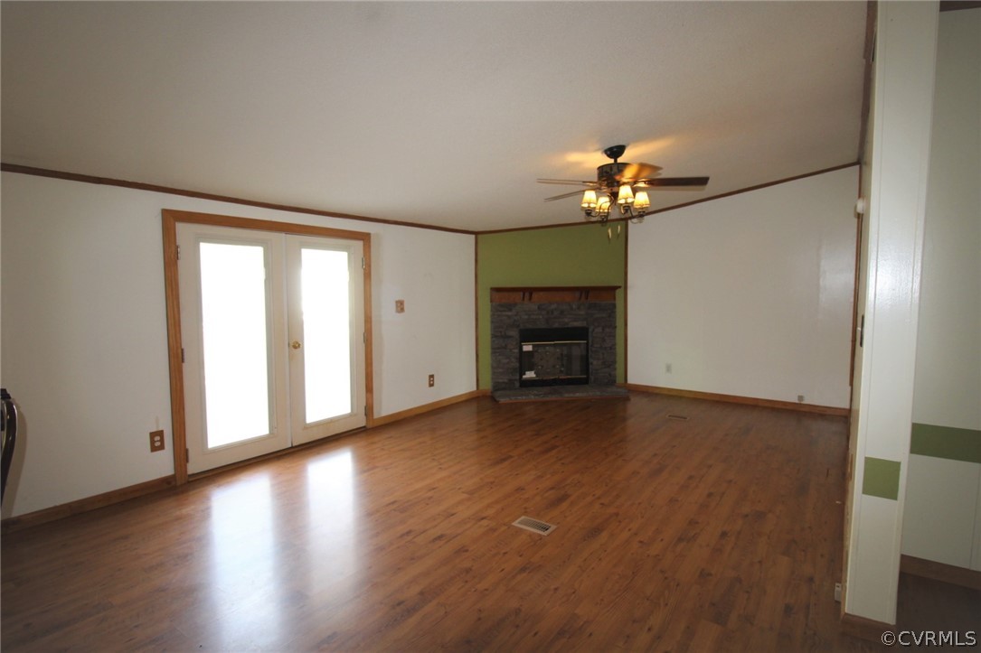 802 Scotts Bottom Road Dillwyn, VA 23936 - Photo 12 of 28 a view of empty room with a fireplace and wooden floor