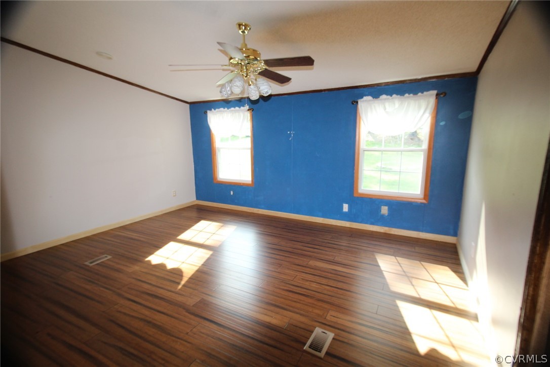 802 Scotts Bottom Road Dillwyn, VA 23936 - Photo 19 of 28 a view of empty room with wooden floor and fan