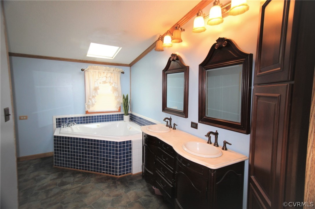 802 Scotts Bottom Road Dillwyn, VA 23936 - Photo 20 of 28 a bathroom with a sink and a mirror