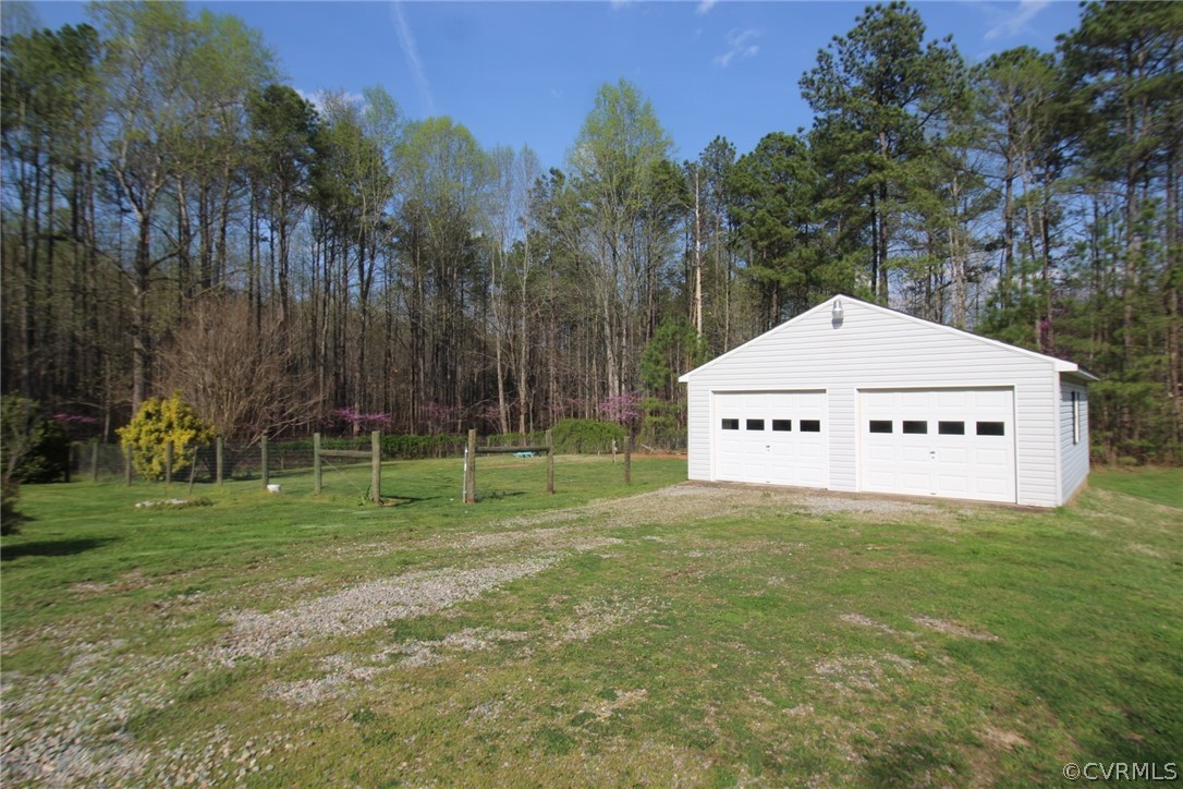 802 Scotts Bottom Road Dillwyn, VA 23936 - Photo 6 of 28 a view of a tiny house with a yard and trees