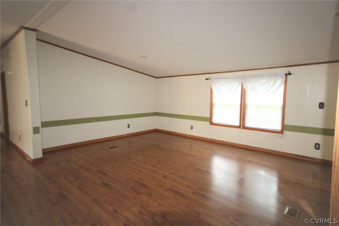 802 Scotts Bottom Road Dillwyn, VA 23936 - Photo 10 of 28 a view of an empty room with wooden floor and a window