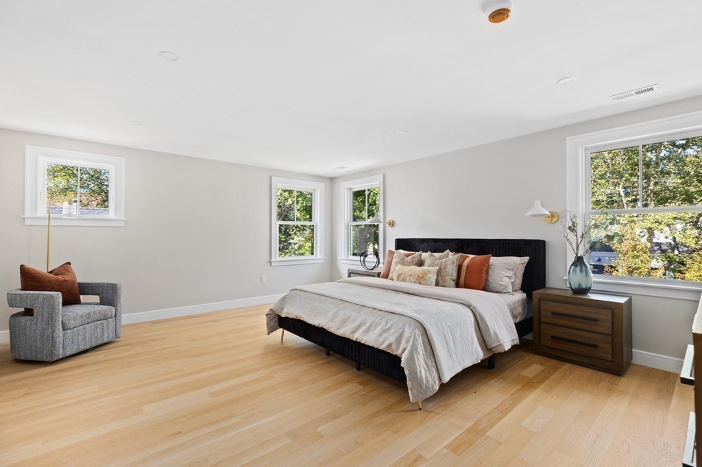 12 Owaisa Road Newton, MA 02468 - Photo 19 of 33 a bed room with a bed and a couch