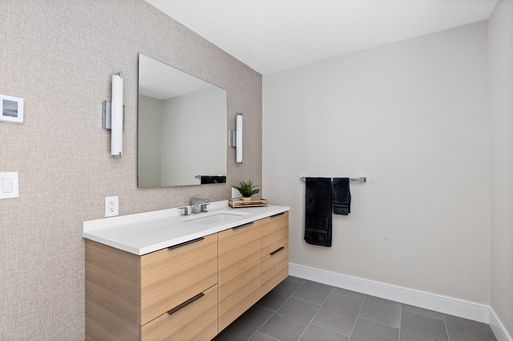 12 Owaisa Road Newton, MA 02468 - Photo 20 of 33 a bathroom with a sink and a mirror