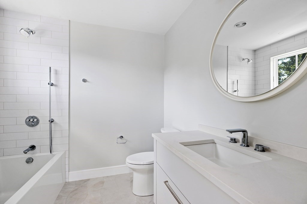 12 Owaisa Road Newton, MA 02468 - Photo 23 of 33 a bathroom with a sink toilet and shower
