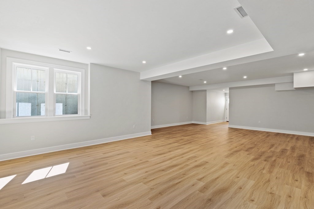12 Owaisa Road Newton, MA 02468 - Photo 29 of 33 a view of empty room with wooden floor and fan