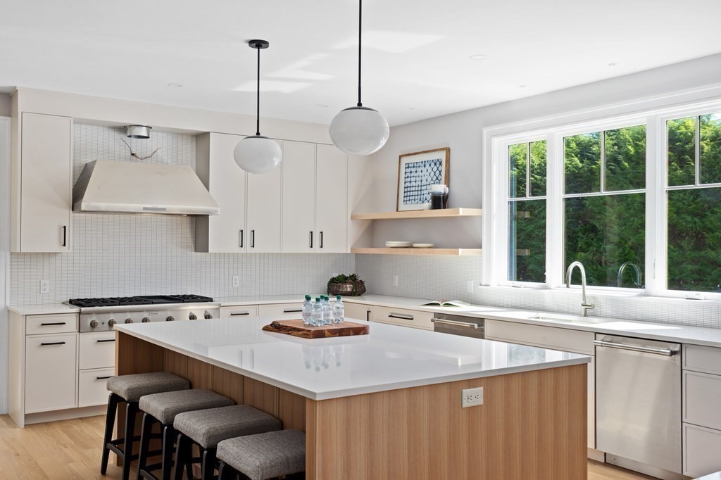 12 Owaisa Road Newton, MA 02468 - Photo 7 of 33 a kitchen with a stove a sink and a wooden floor