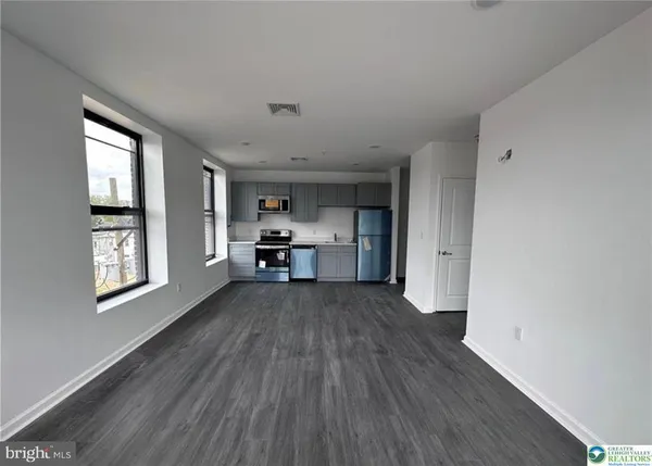 a view of kitchen and wooden floor