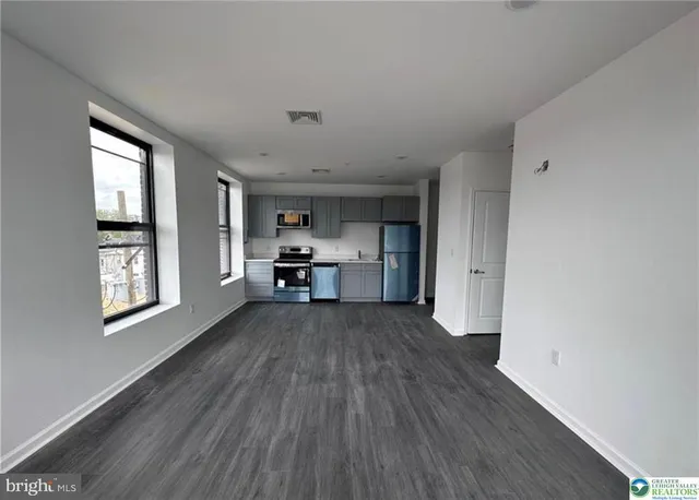 a view of kitchen and wooden floor