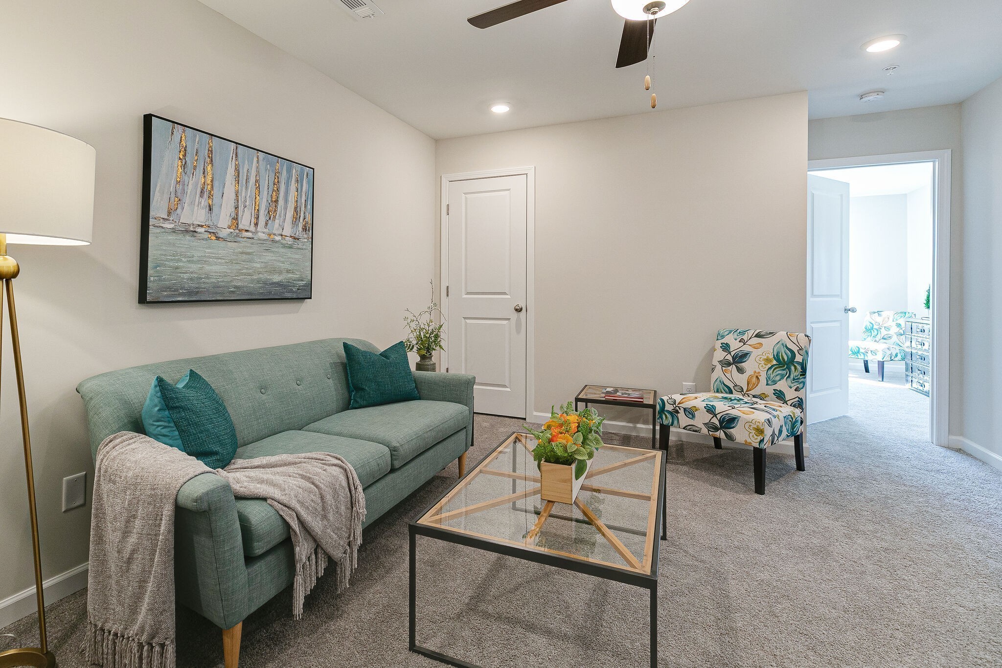 1056 June Wilde Ridge Spring Hill, TN 37174 - Photo 21 of 29 a living room with furniture and a chandelier