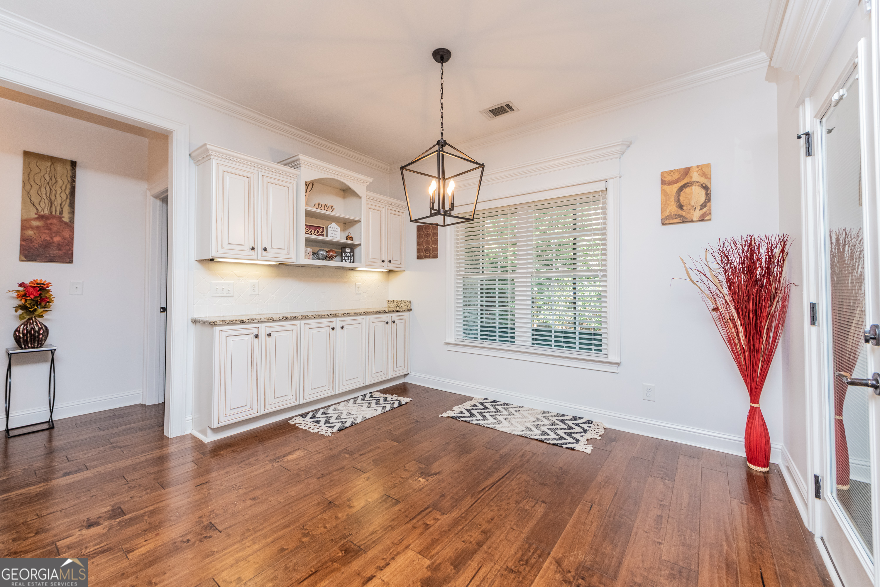 405 Old Bridge Road Warner Robins, GA 31088 - Photo 17 of 55 a kitchen with stainless steel appliances granite countertop a sink stove and wooden floor