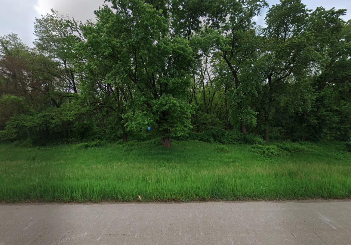 365 Shadyside Road Burns Harbor, IN 46304 - Photo 2 of 5 a view of a grassy field with trees