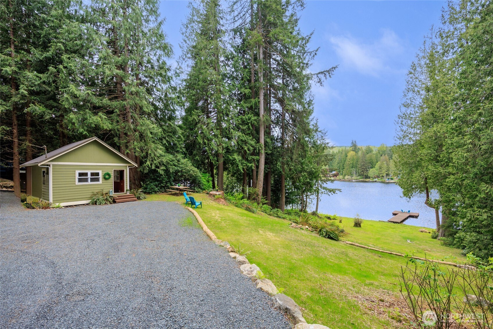 1028 South Lake Roesiger Road Snohomish, WA 98290 - Photo 24 of 38 a view of a house with a yard and large trees