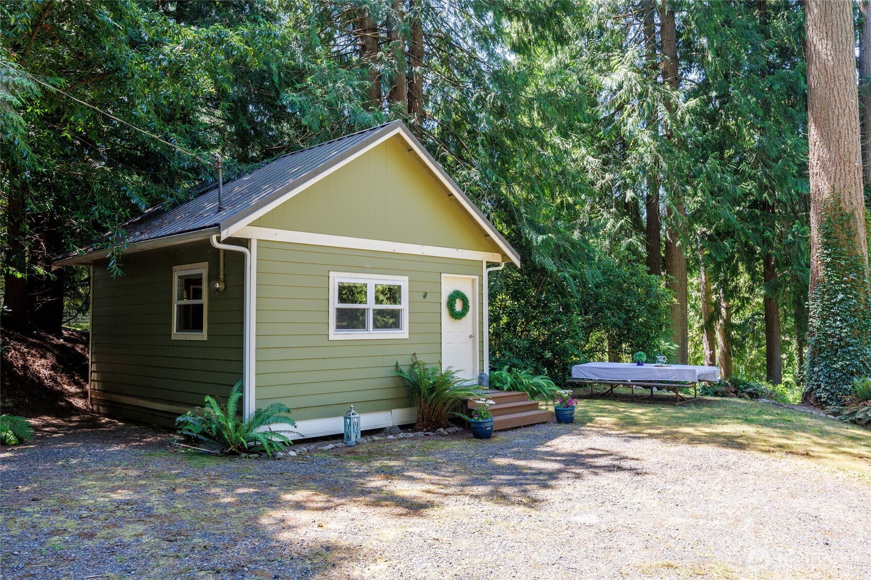 1028 South Lake Roesiger Road Snohomish, WA 98290 - Photo 26 of 38 a view of a house with backyard and garden