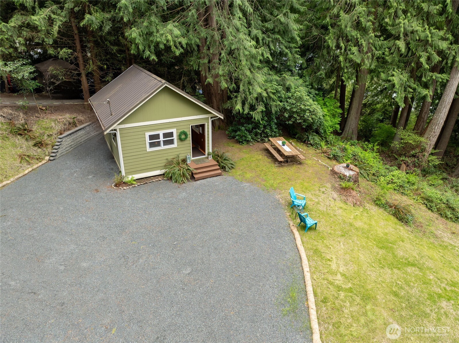 1028 South Lake Roesiger Road Snohomish, WA 98290 - Photo 29 of 38 a house with trees in the background