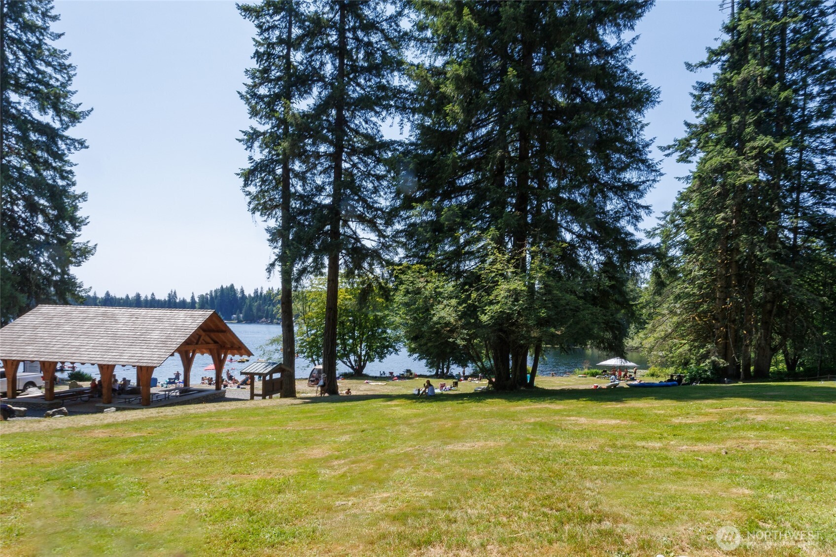 1028 South Lake Roesiger Road Snohomish, WA 98290 - Photo 33 of 38 a view of swimming pool and trees in the background