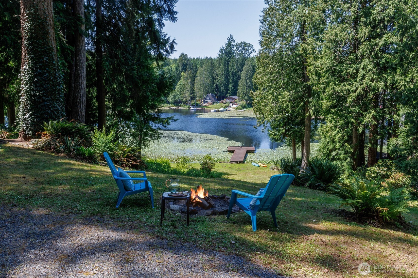 1028 South Lake Roesiger Road Snohomish, WA 98290 - Photo 36 of 38 a view of a table and chairs in the garden