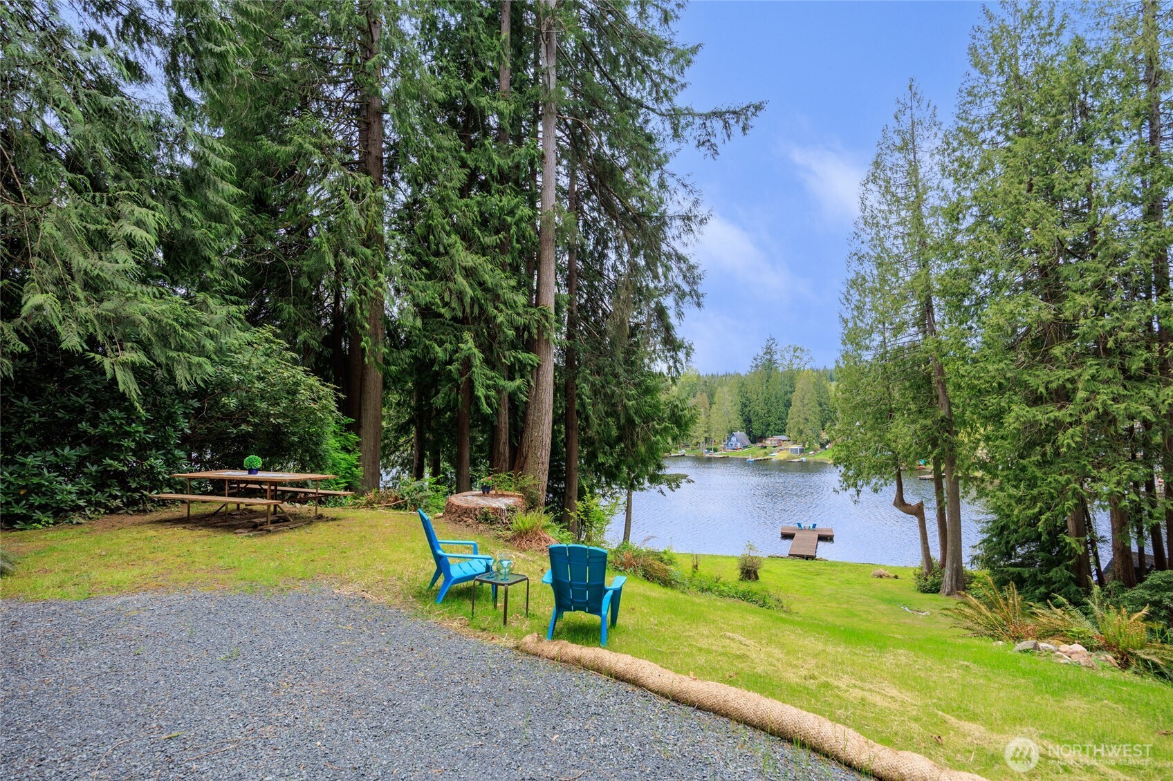 1028 South Lake Roesiger Road Snohomish, WA 98290 - Photo 4 of 38 a view of swimming pool with sitting area and garden