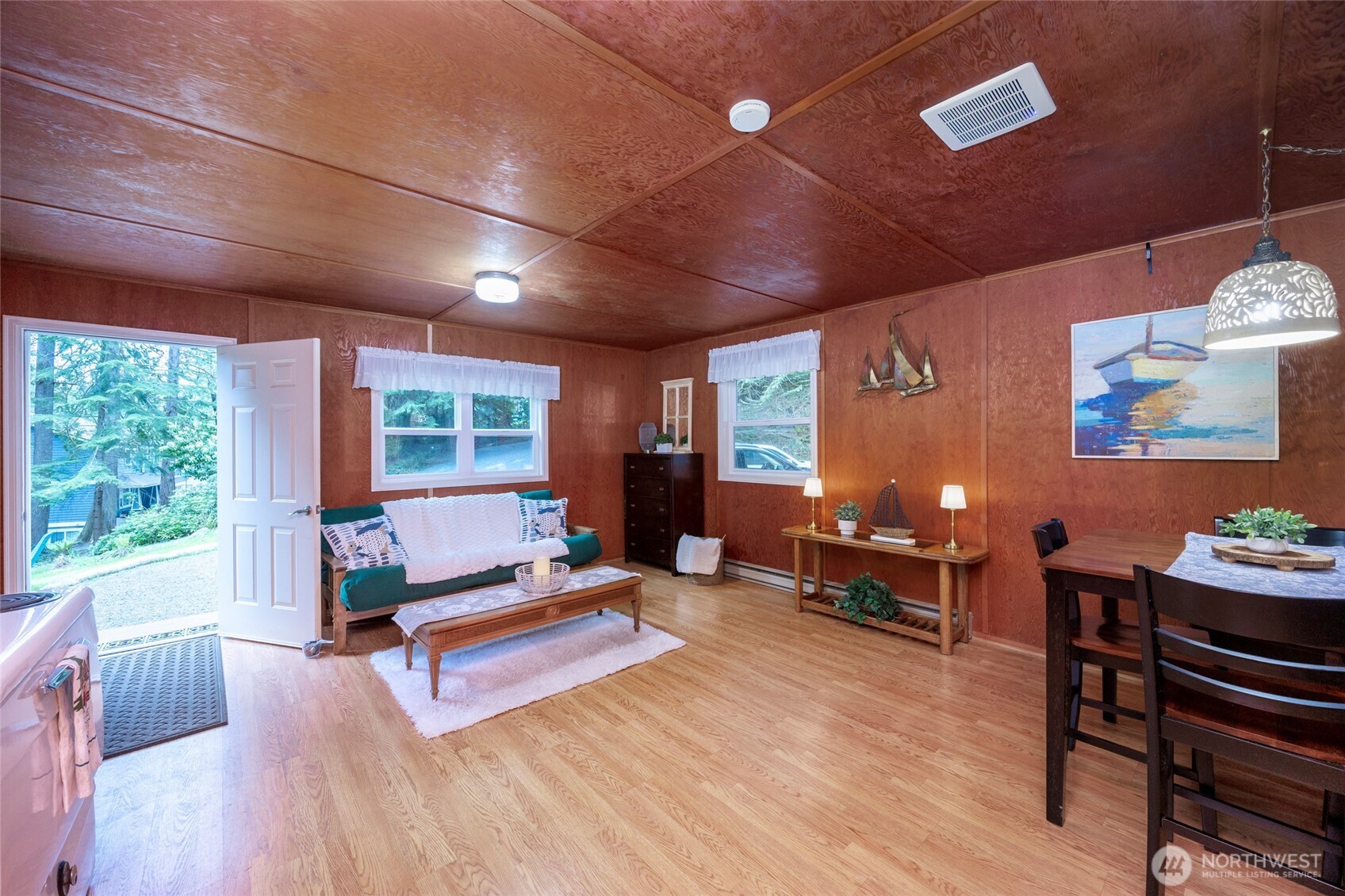 1028 South Lake Roesiger Road Snohomish, WA 98290 - Photo 7 of 38 a living room with furniture a wooden floor and window