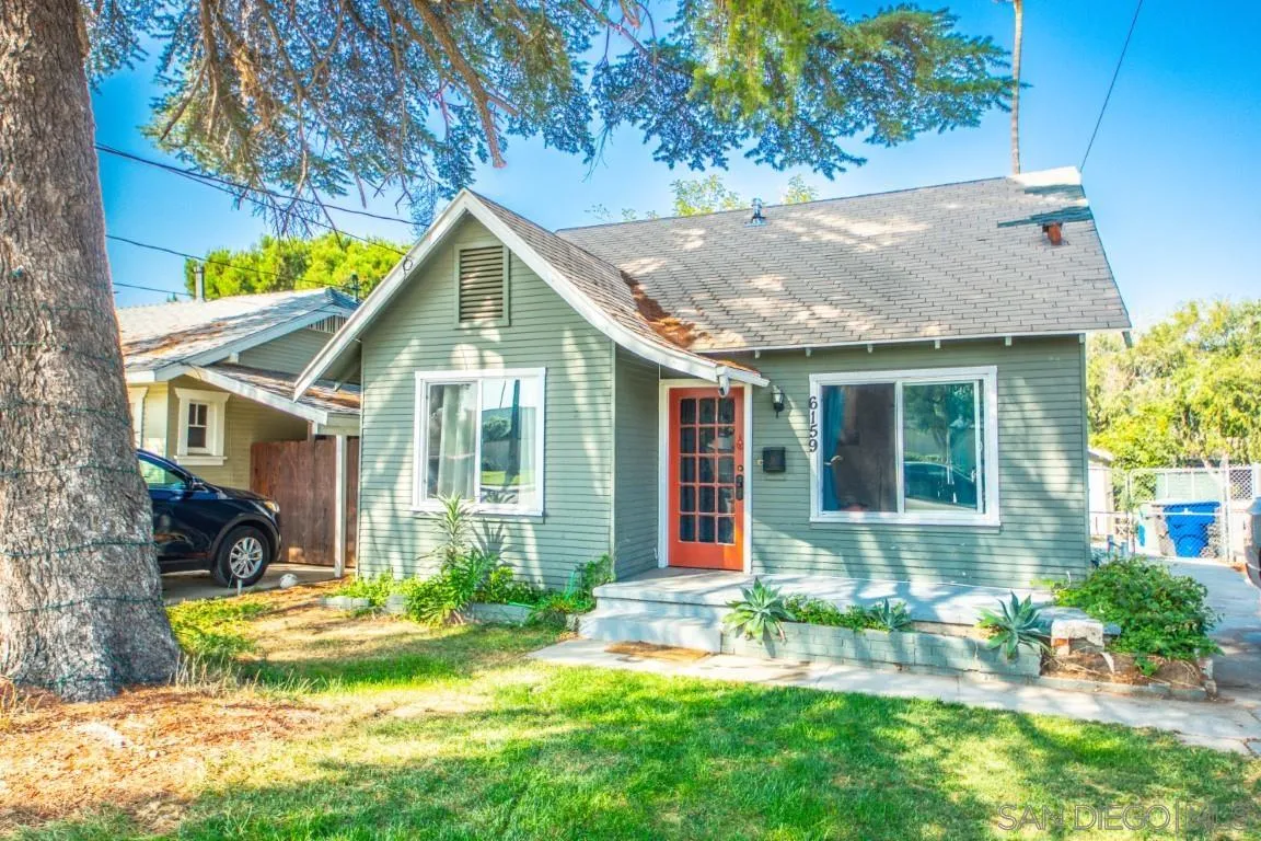 6159 Nogales Street Riverside, CA 92506 - Photo 1 of 14 a front view of house with yard and green space