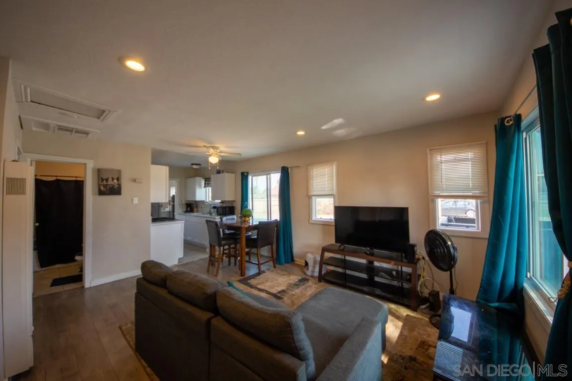 6159 Nogales Street Riverside, CA 92506 - Photo 3 of 14 a living room with furniture and a flat screen tv