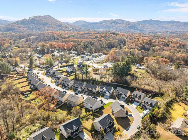an aerial view of residential house and sandy dunes
