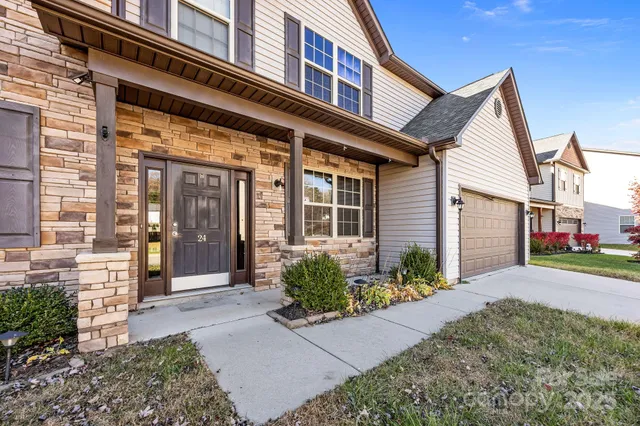 a front view of a building with garden