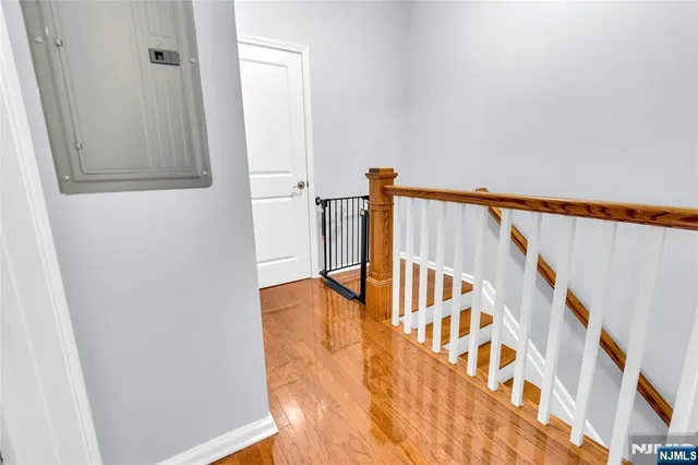 a view of an entryway with wooden floor