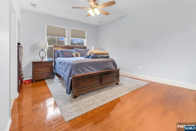a spacious bedroom with a bed and window