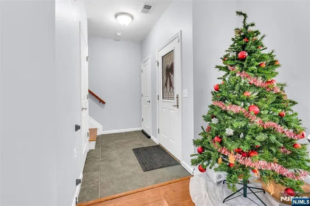 a bedroom with furniture a baby crib and a window