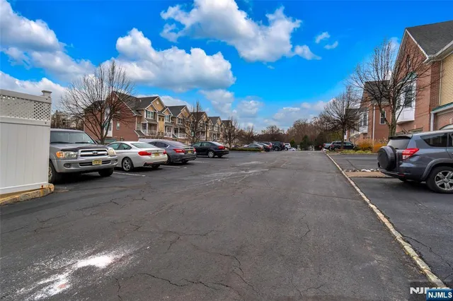 a view of street with parked cars