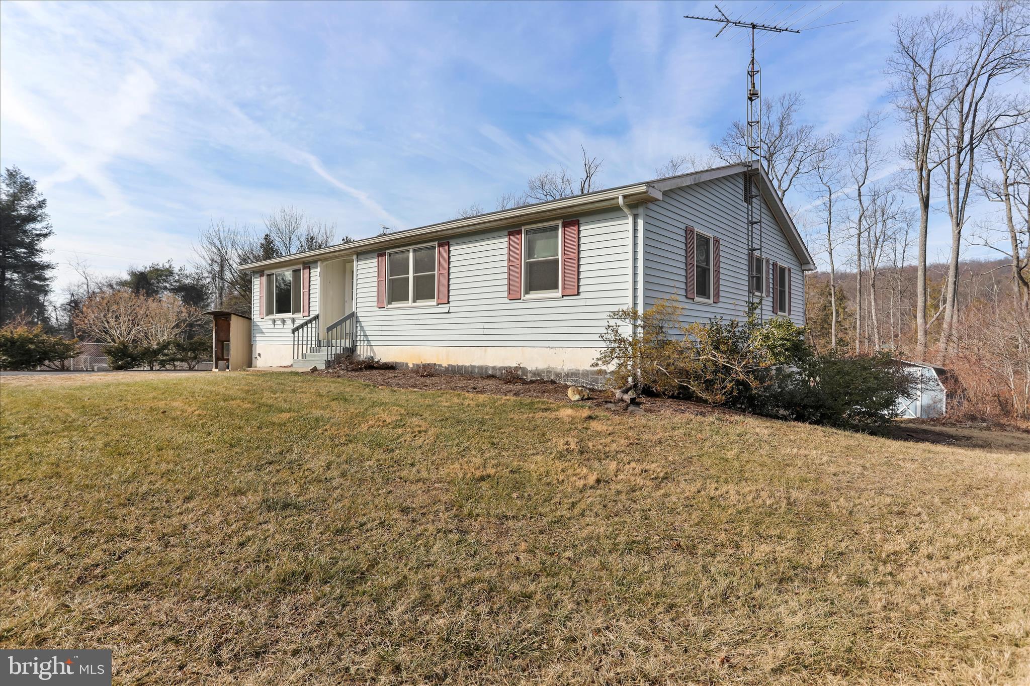 24744 Raven Rock Road Smithsburg, MD 21783 - Photo 2 of 49 a house view with a garden space