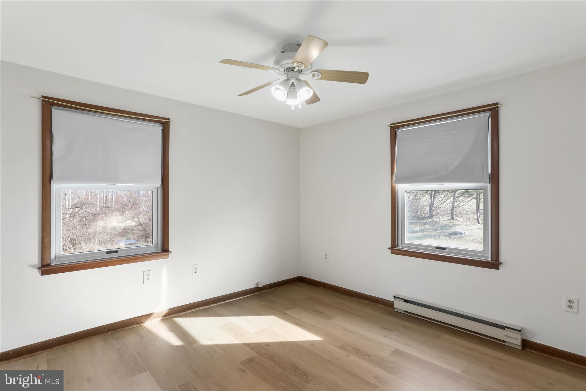24744 Raven Rock Road Smithsburg, MD 21783 - Photo 26 of 49 a view of an empty room with a window and a ceiling fan