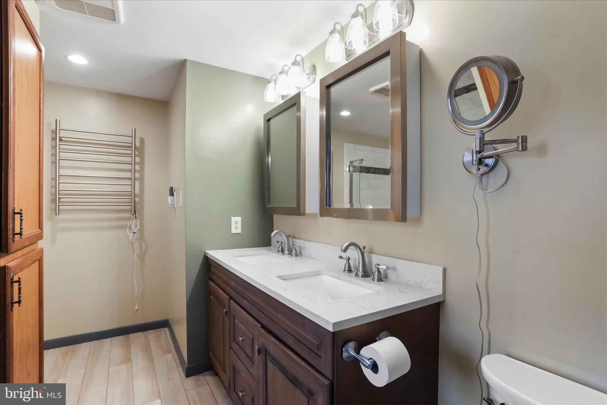 24744 Raven Rock Road Smithsburg, MD 21783 - Photo 29 of 49 a bathroom with a sink a toilet and a mirror