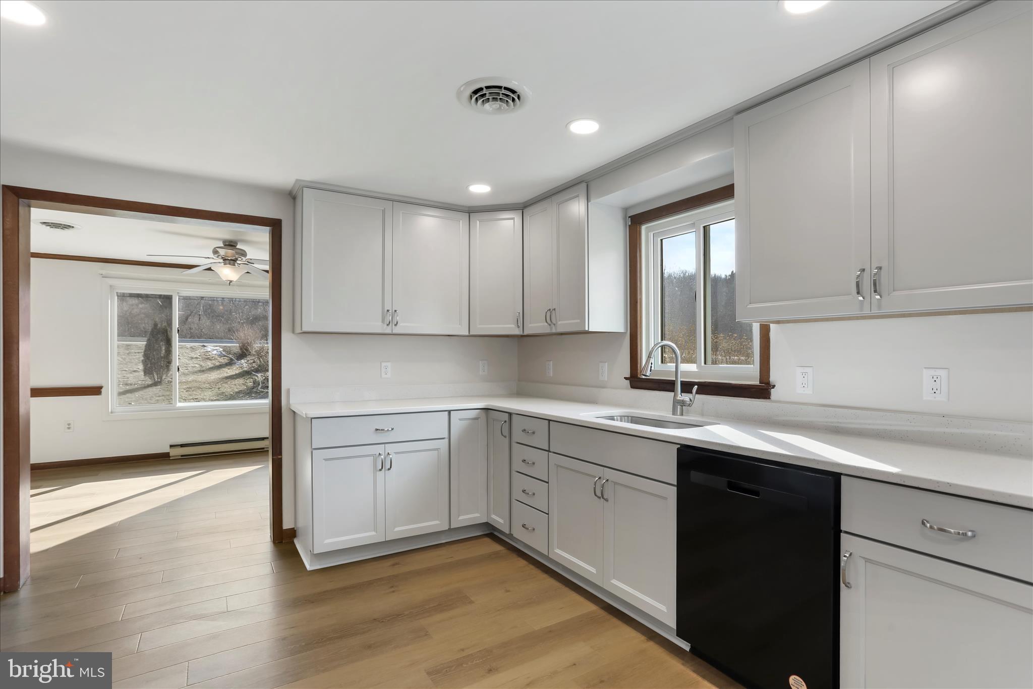 24744 Raven Rock Road Smithsburg, MD 21783 - Photo 6 of 49 a kitchen with a sink cabinets and window