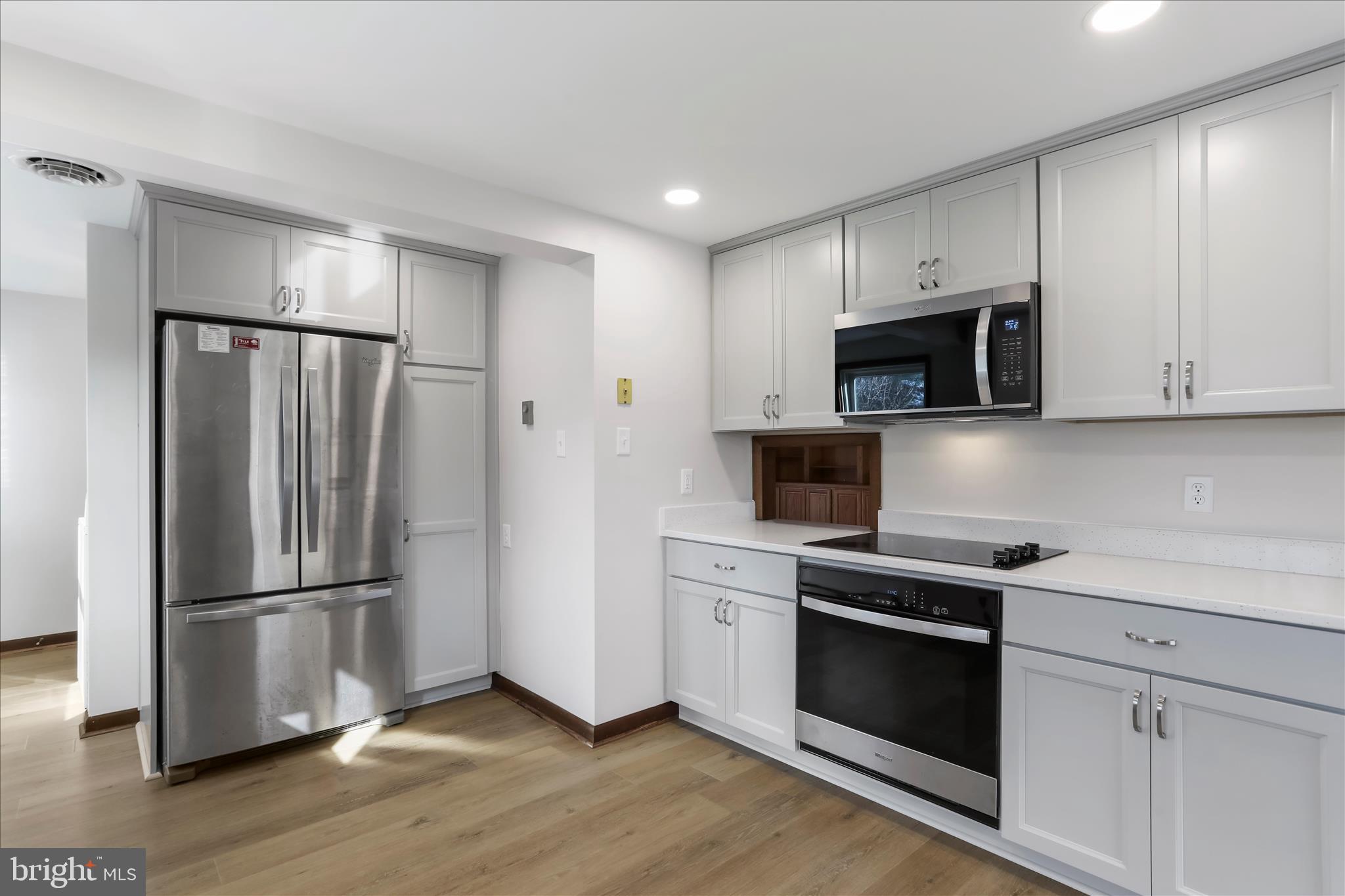 24744 Raven Rock Road Smithsburg, MD 21783 - Photo 8 of 49 a kitchen with a refrigerator stove and microwave
