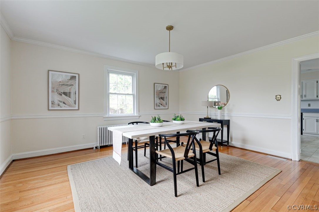4801 Coleman Road Richmond, VA 23230 - Photo 17 of 42 Sleek modern chandelier balances the elegant mouldings.