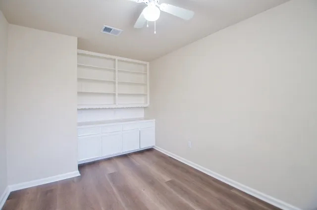 a view of an empty walk in closet