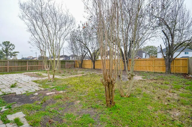 a view of yard with swimming pool
