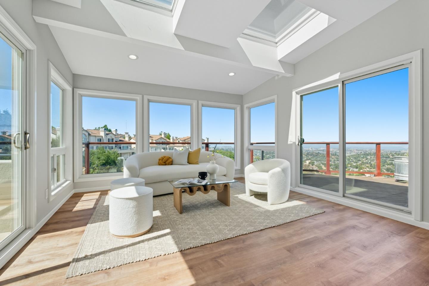 1 Lewis Ranch Road San Carlos, CA 94070 - Photo 23 of 111 a living room with furniture large windows and wooden floor