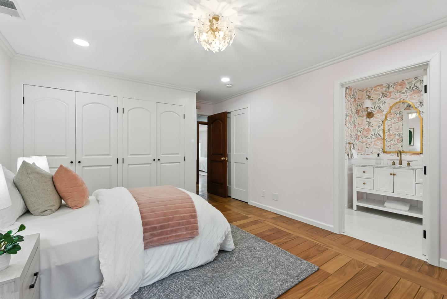 1 Lewis Ranch Road San Carlos, CA 94070 - Photo 43 of 111 a bedroom with a bed and a chandelier