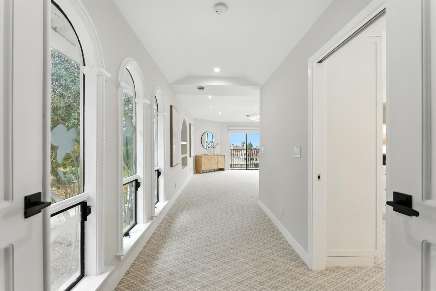 1 Lewis Ranch Road San Carlos, CA 94070 - Photo 48 of 111 a view of a hallway with wooden floor and windows