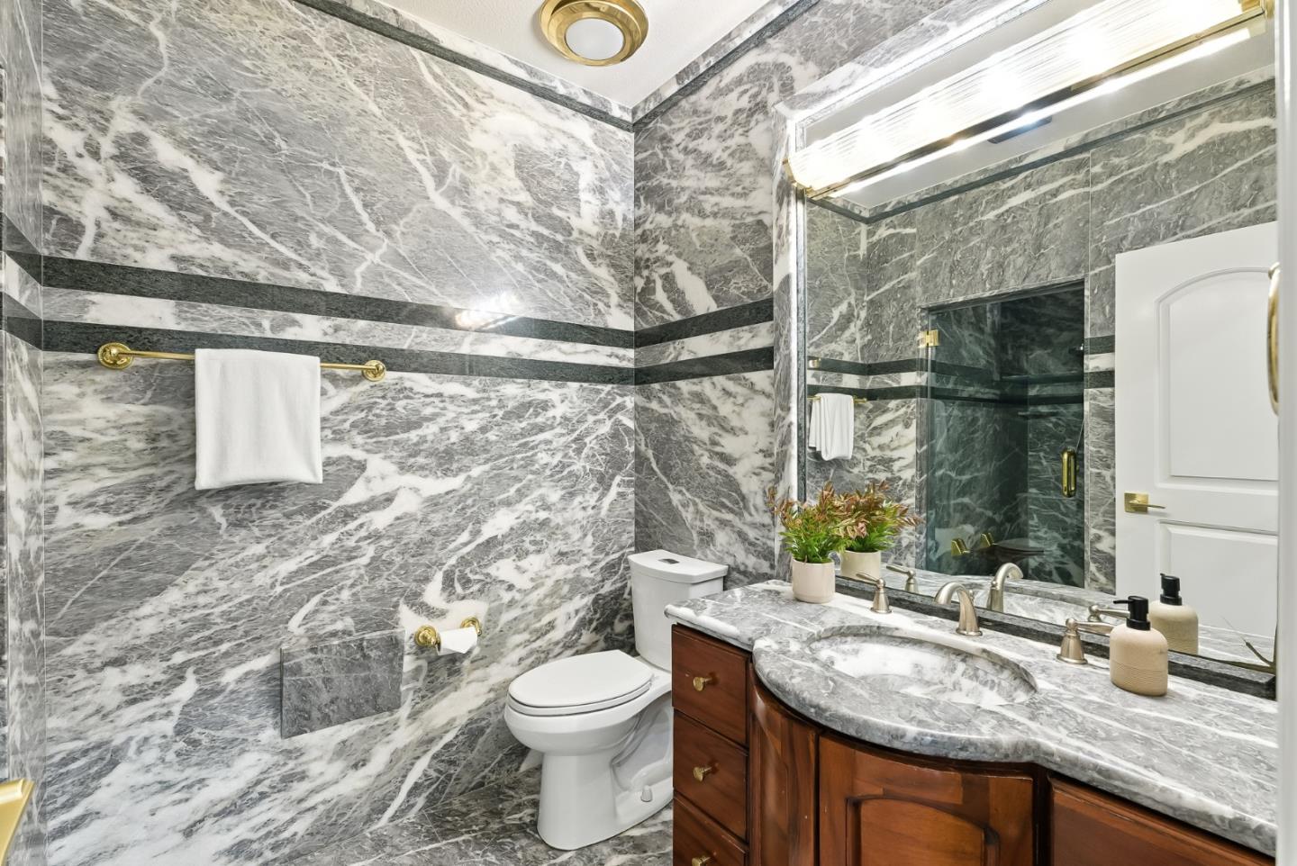 1 Lewis Ranch Road San Carlos, CA 94070 - Photo 68 of 111 a bathroom with a granite countertop sink a toilet and shower