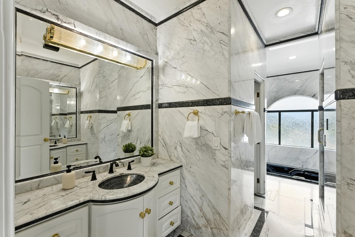 1 Lewis Ranch Road San Carlos, CA 94070 - Photo 76 of 111 a bathroom with a granite countertop sink a mirror and shower