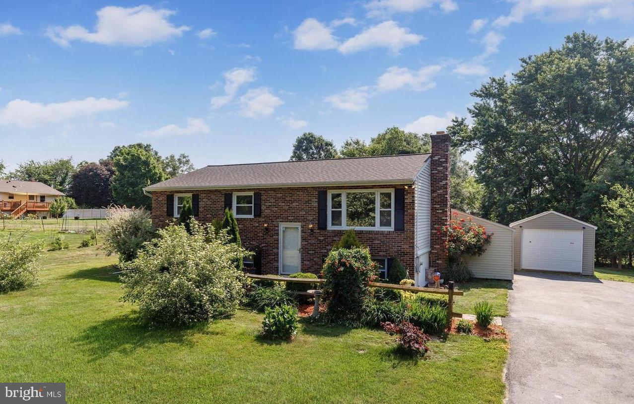3500 East Lawndale Road Reisterstown, MD 21136 - Photo 1 of 31 a front view of a house with garden