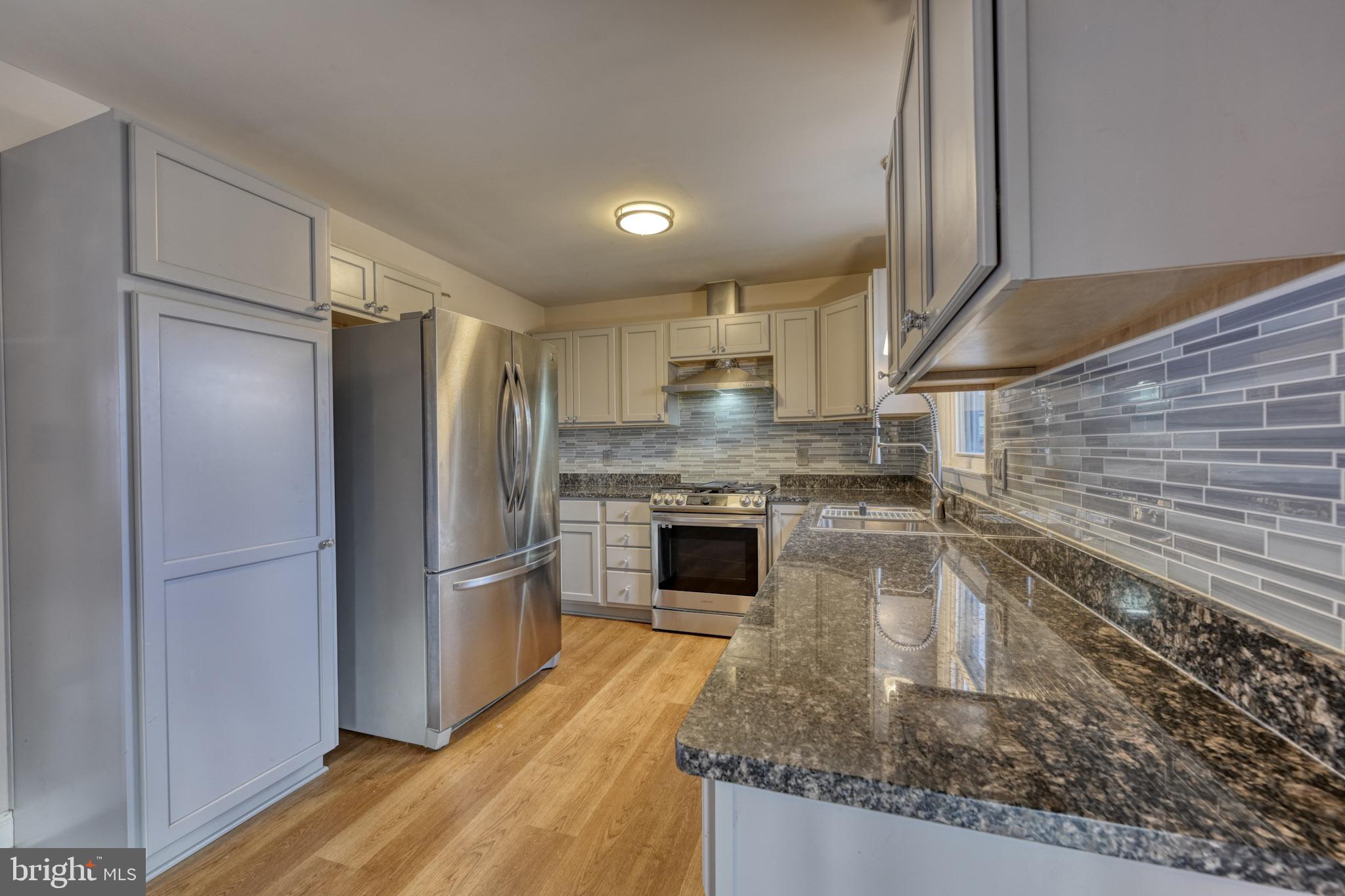 3500 East Lawndale Road Reisterstown, MD 21136 - Photo 12 of 31 a kitchen with granite countertop stainless steel appliances a counter top space and cabinets